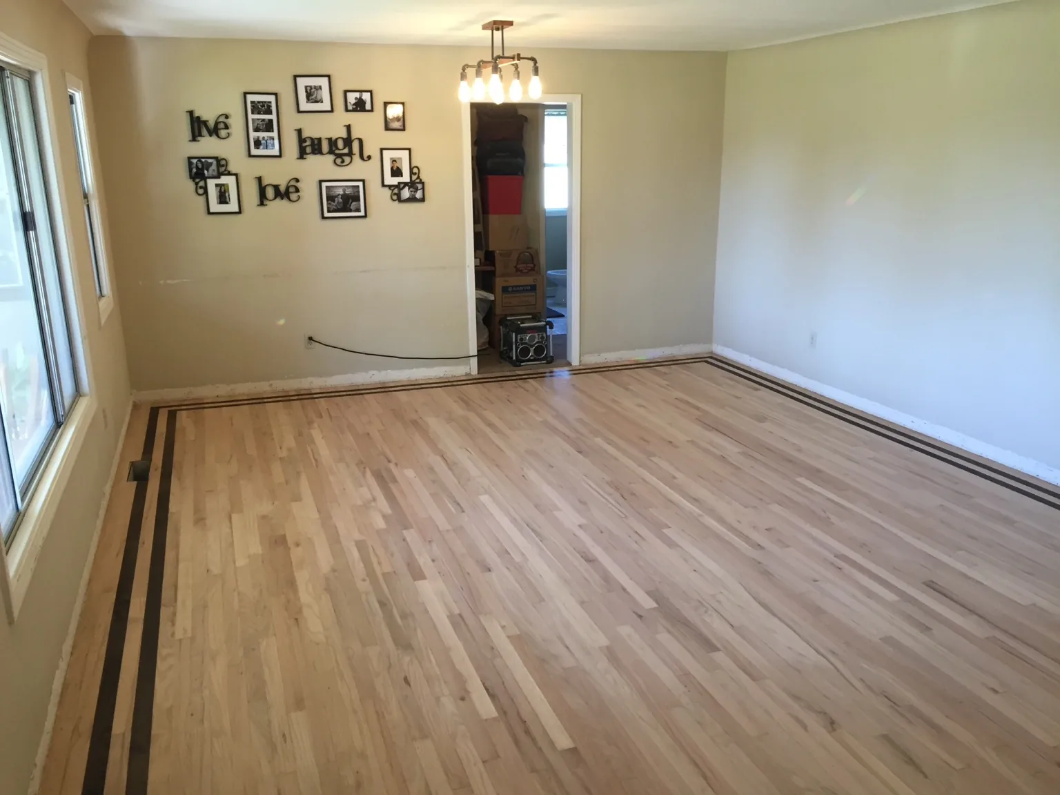 Refinished oak floor with custom dark border in Manteca