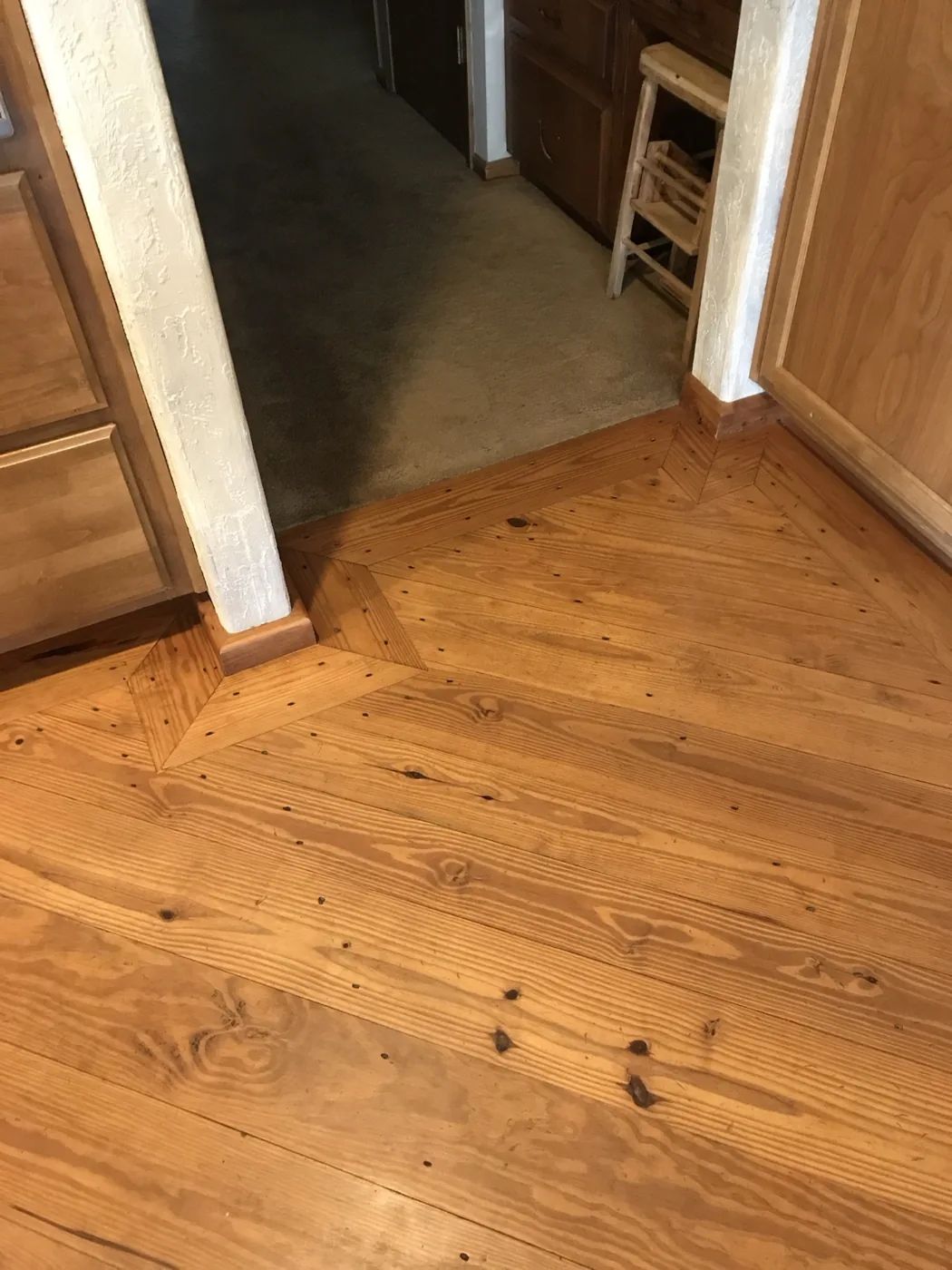Knotty pine floor with picture frame border in Pollock Pines